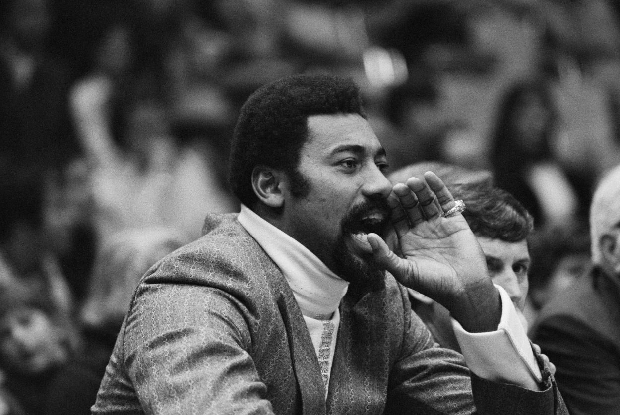 Wilt Chamberlain shouts instructions to his team from the bench.