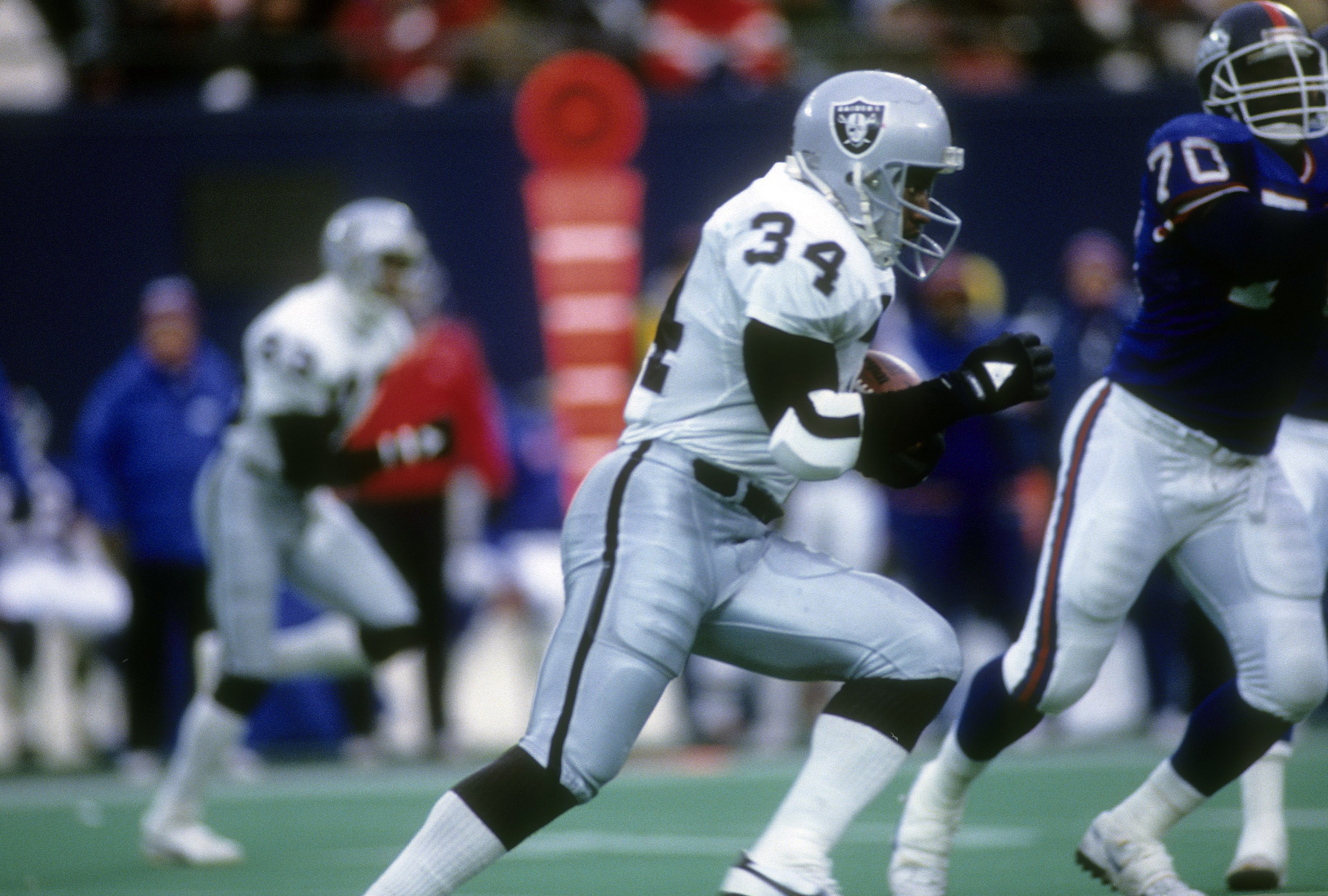 Running back Bo Jackson of the Los Angeles Raiders carries the ball.