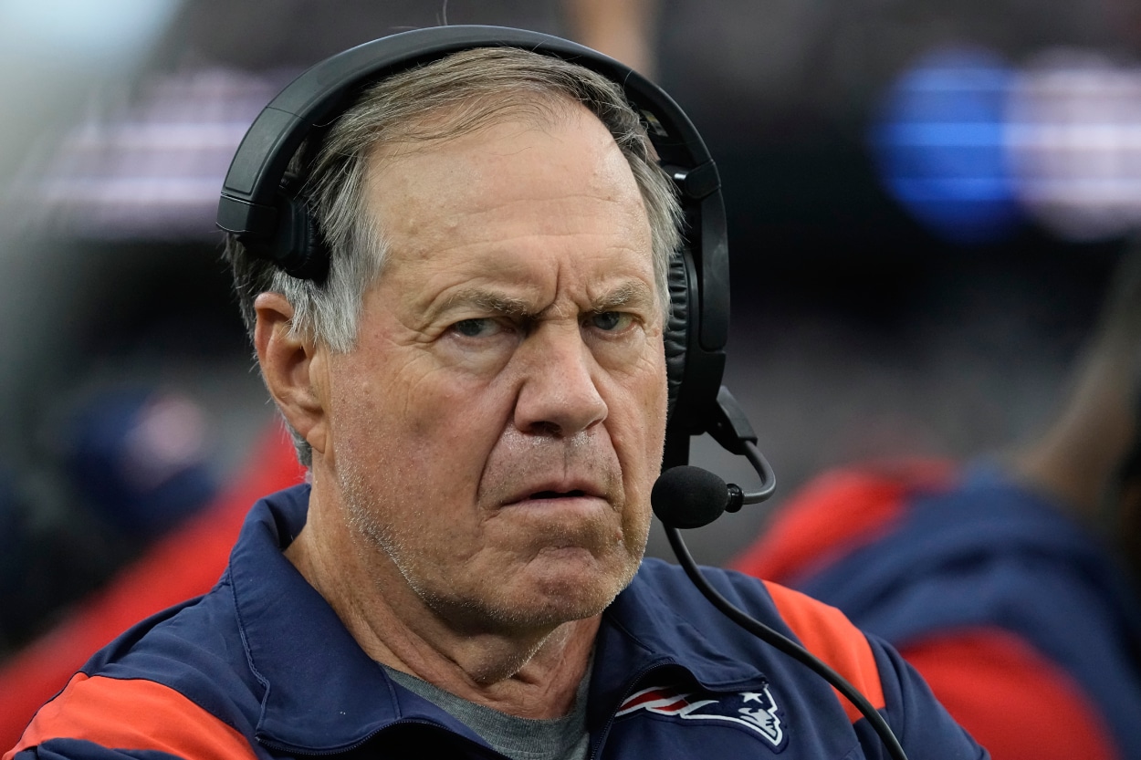 New England Patriots head coach Bill Belichick stands on the sideline.