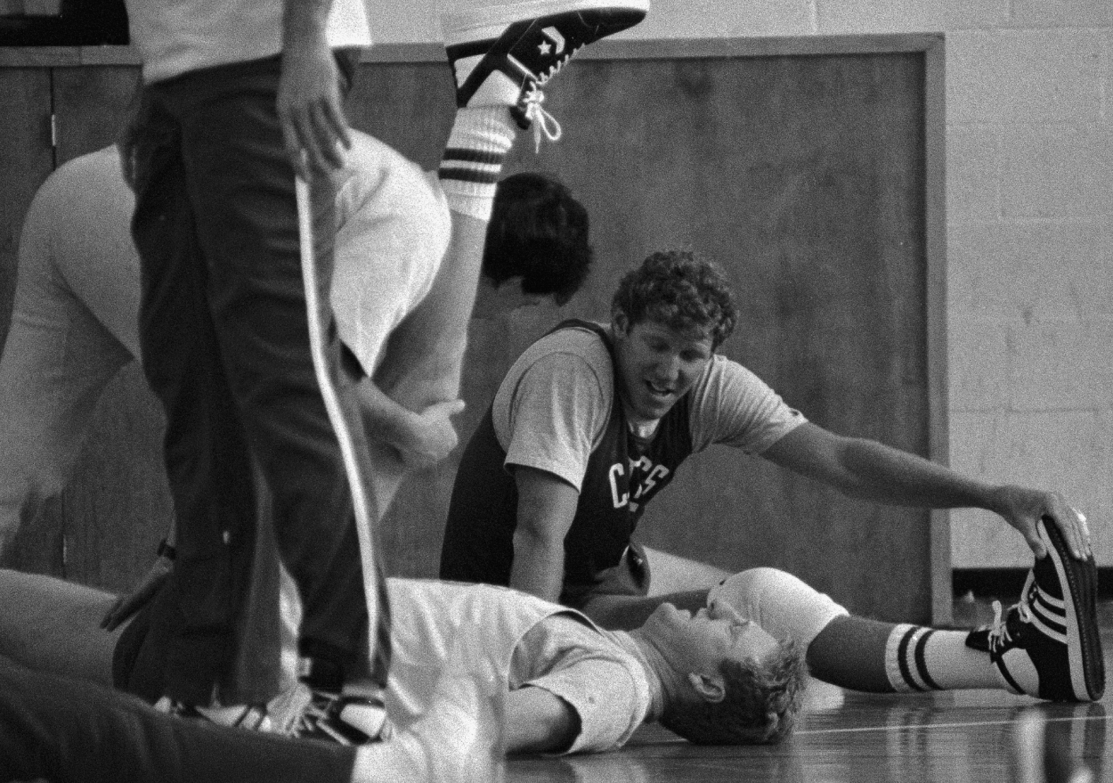 Boston Celtics center Bill Walton (rear) recovering from foot surgery, works out with teammate Larry Bird.