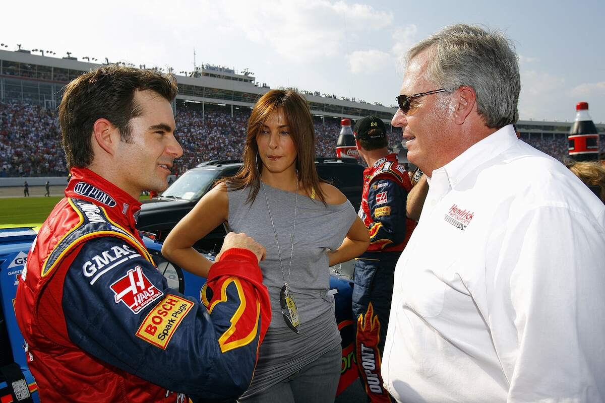 Jeff Gordon, driver of the #24 DuPont Chevrolet, talks with his girlfriend Ingrid Vandebosch and car owner Rick Hendrick before the NASCAR Nextel Cup Series Coca-Cola 600