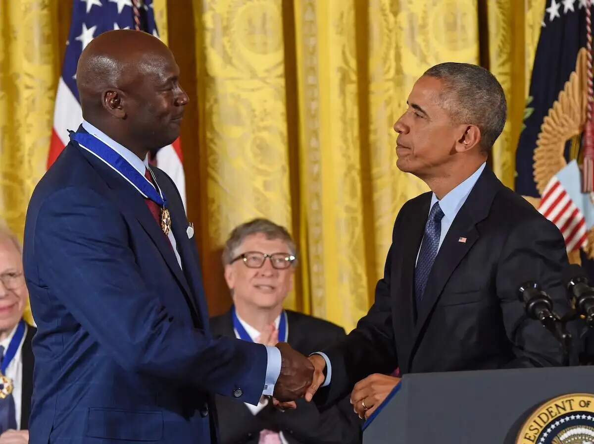 NBA star Michael Jordan shakes hands with Barack Obama