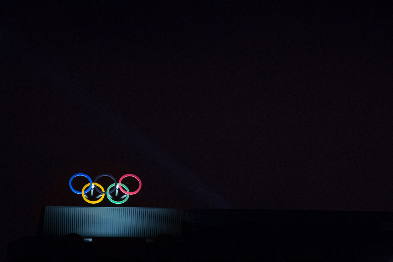 Olympic symbol (also known as Olympic Rings) seen on the Montreal olympic Committee building lit during a dark night. Montreal became an olympic city with the 1976 Summer Olympic Games