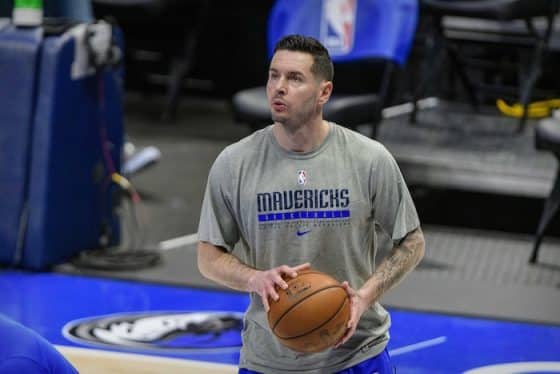 JJ Redick holdas a basketball.