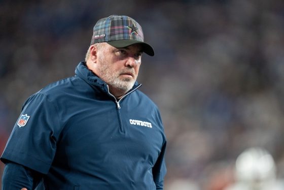 Dallas Cowboys head coach Mike McCarthy walks into the locker room.