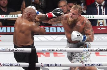 Mike Tyson fights Jake Paul in the ring.