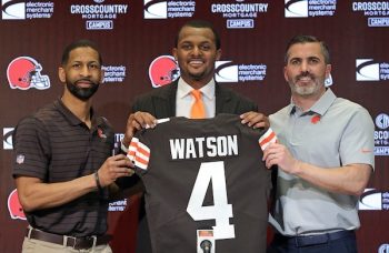Cleveland Browns quarterback Deshaun Watson holds his jersey.