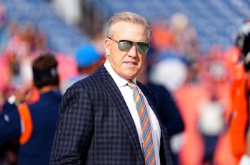 Denver Broncos president John Elway looks and stares.