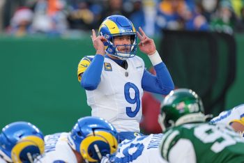 Matthew Stafford points to helmet.