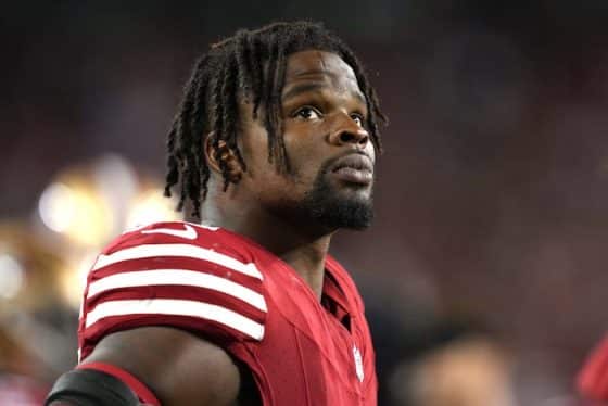 San Francisco 49ers linebacker Dre Greenlaw looks up.