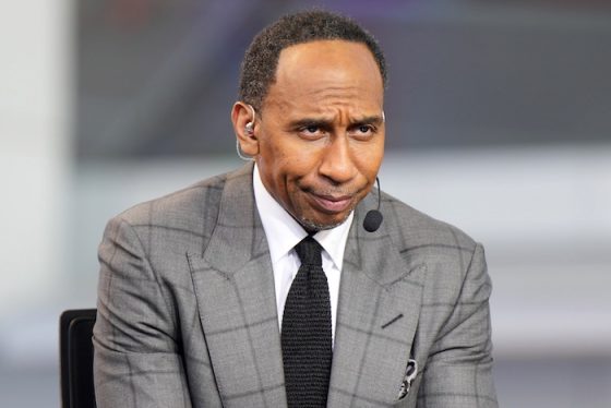 Stephen A. Smith sits at a desk and stares.