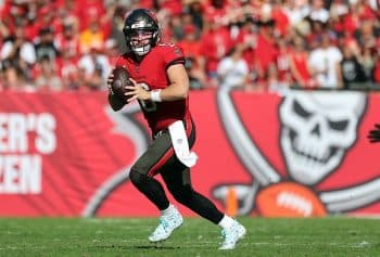 Tampa Bay Buccaneers quarterback Baker Mayfield runs out of the pocket .