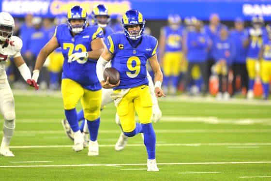 Matthew Stafford carries the ball and runs.
