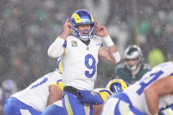 Matthew Stafford points to his helmet.