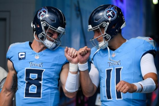 Tennessee Titans Will Levis and quarterback Mason Rudolph hit hands.