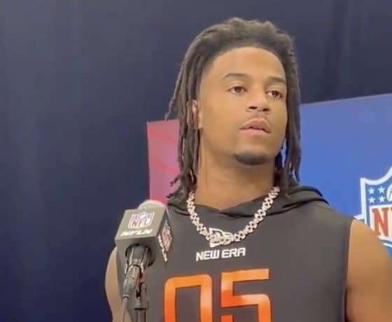 Isaiah Bond speaks in front of the media.