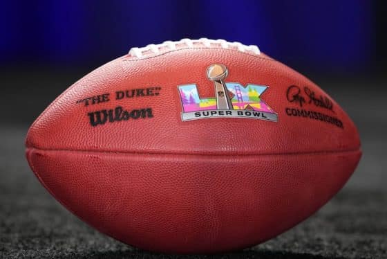 A picture of an NFL football with a Super Bowl logo.