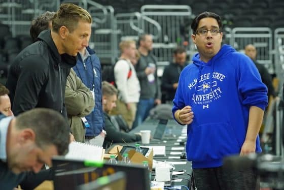 Amir Khan, McNeese State men's basketball manager stands and looks.