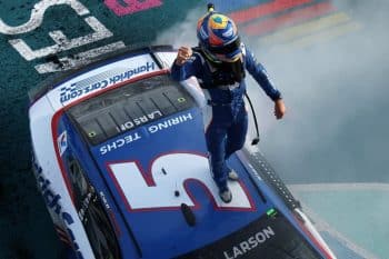 Cup Kyle Larson stadning on roof after win at homestead (1)