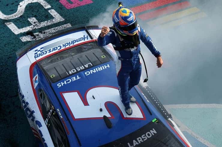 Cup Kyle Larson stadning on roof after win at homestead (1)