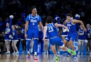 Drake basketball players celebrate.