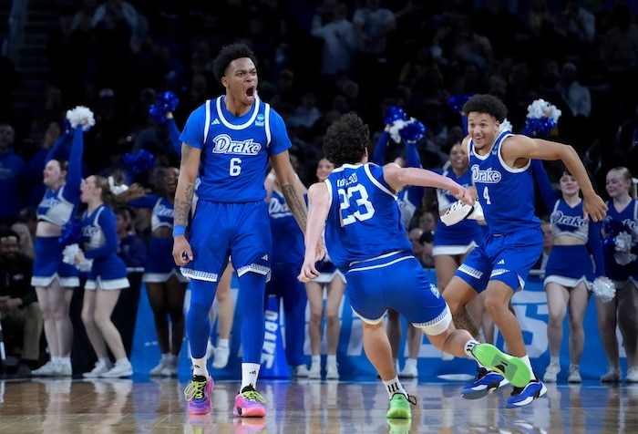 Drake basketball players celebrate.
