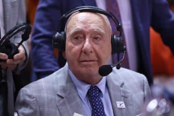 Dick Vitale on the microphone at a game.