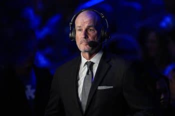 Jay Bilas stands and stares on the mic.