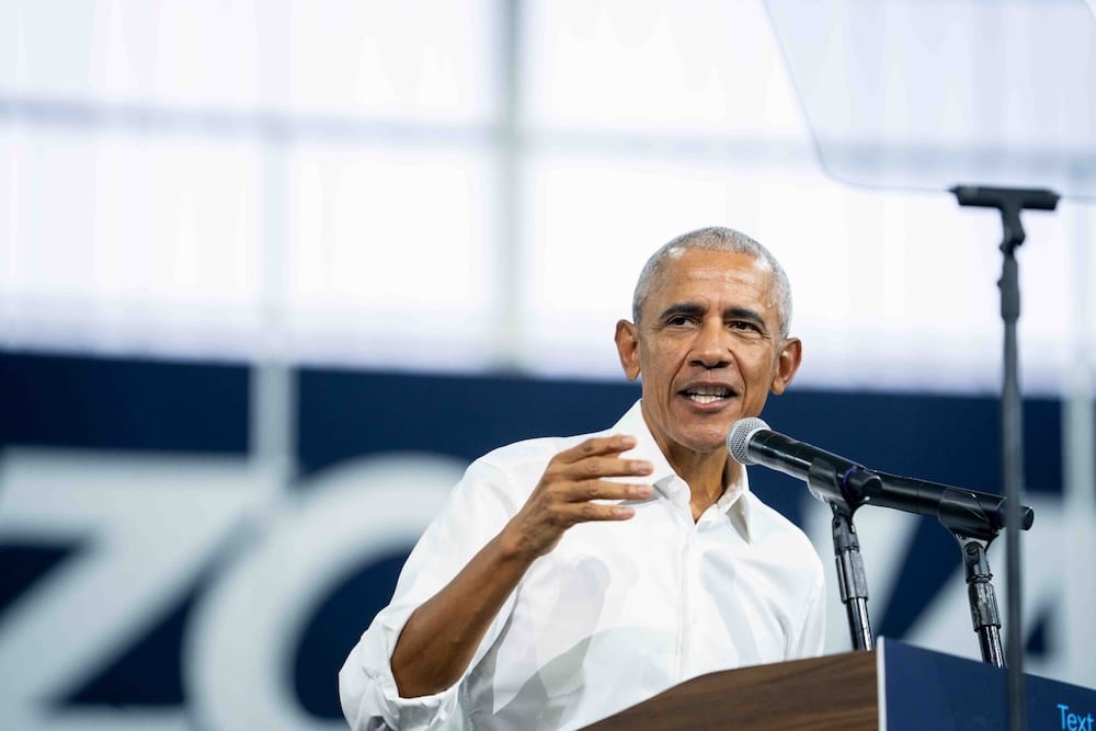 Barack Obama stands at a podium.