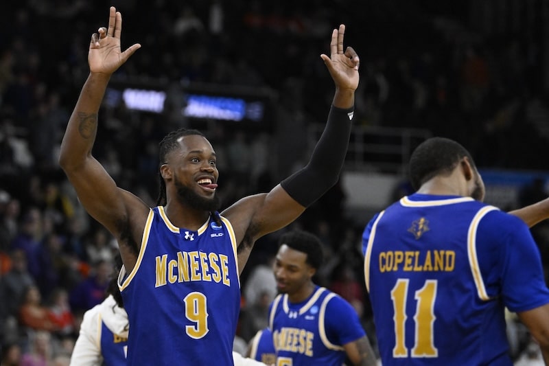 McNeese players put hands up.