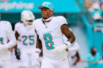 Jevon Holland runs out of the tunnel for the Dolphins.