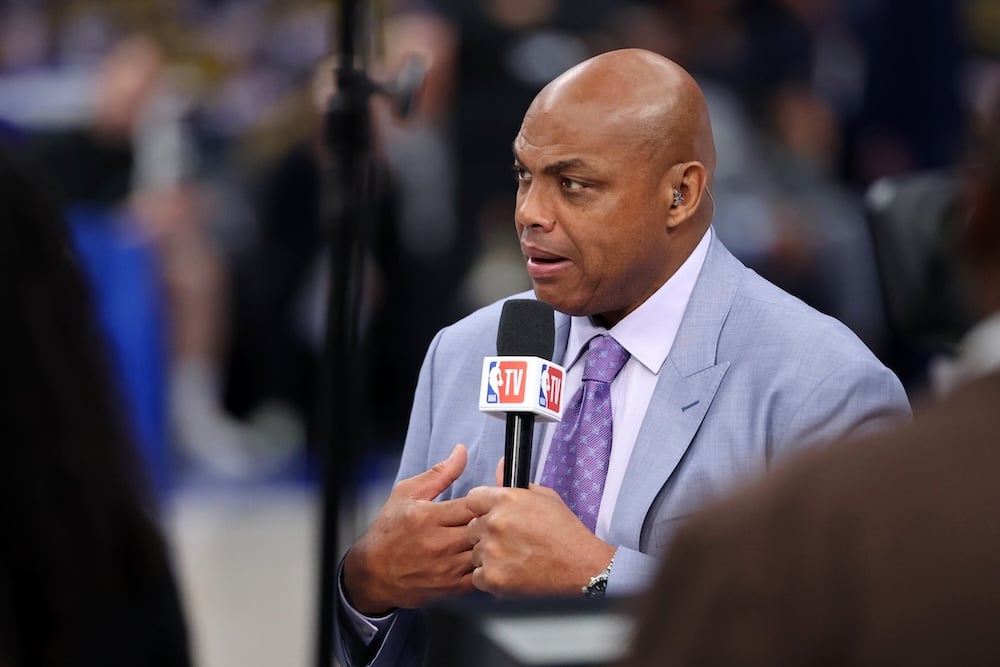 NBA TV analyst Charles Barkley holds a mic.