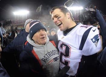 New England Patriots quarterback Tom Brady stands with Bill Belichick.