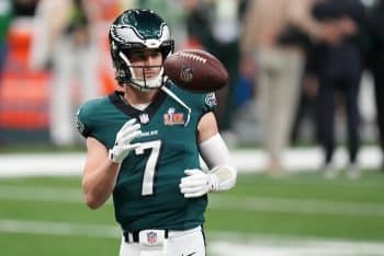 Philadelphia Eagles quarterback Kenny Pickett throws a ball in the air.