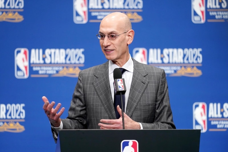 NBA commissioner Adam Silver stands at podium.
