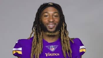 Aaron Jones smiles and stares.