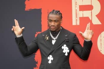 Alabama Crimson Tide quarterback Jalen Milroe puts his hands up.