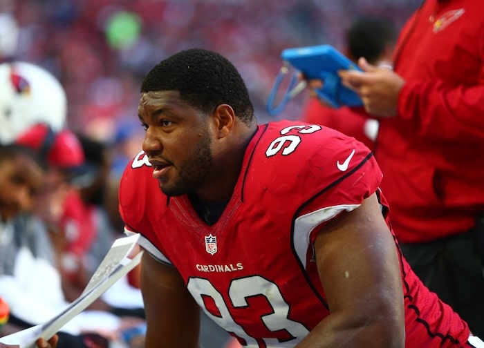 Calais Campbell sits on the sideline.