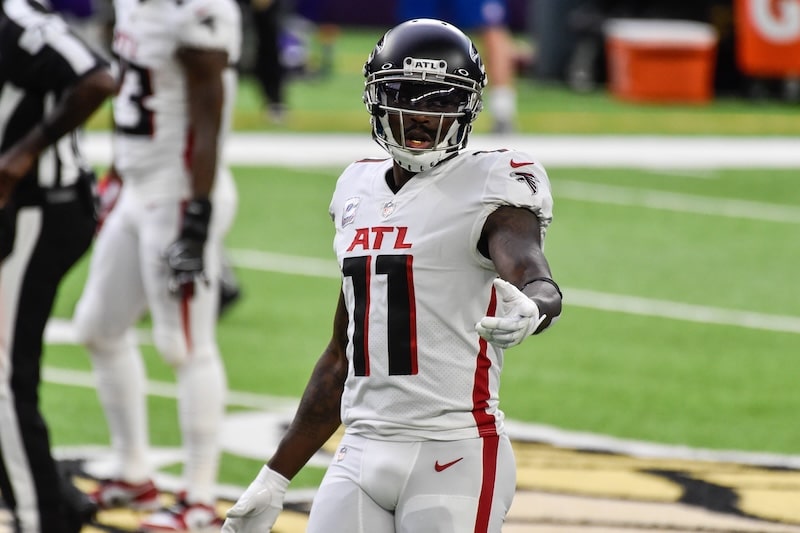 Julio Jones points his hand and stands.