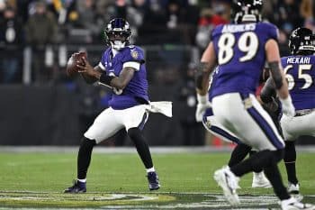 Lamar Jackson reaches back to pass.