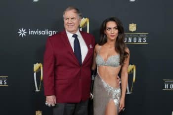 Bill Belichick and Jordan Hudson pose for a photo.
