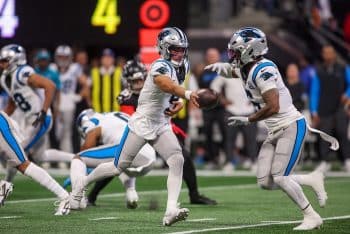 Carolina Panthers quarterback Bryce Young (9) hands the ball off.