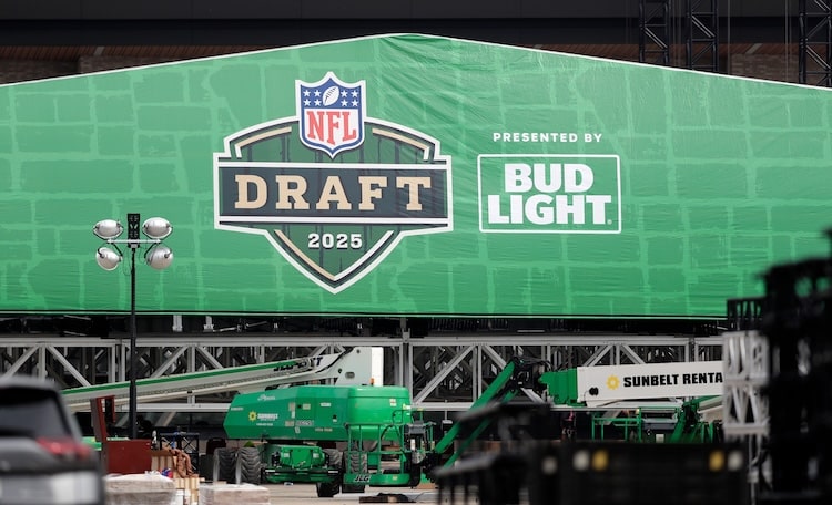 Crews work to raise the roof of the NFL draft theater on April 9, 2025.