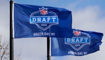 Flags promoting the 2025 NFL Draft flying in the wind.