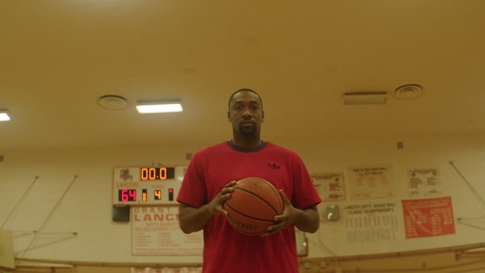 Gilbert Arenas holds a basketbll.