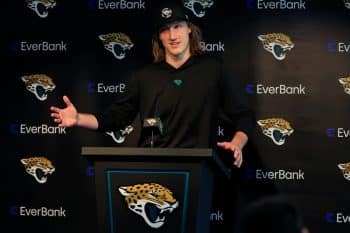 Jacksonville Jaguars quarterback Trevor Lawrence stands at a podium.
