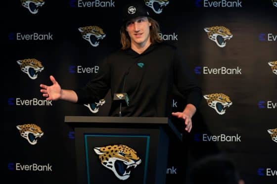 Jacksonville Jaguars quarterback Trevor Lawrence stands at a podium.