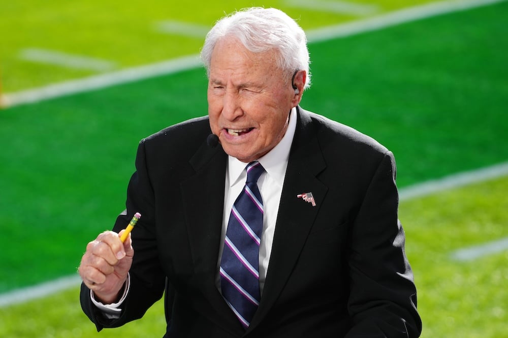 Lee Corso puts his hand up on College GameDay.
