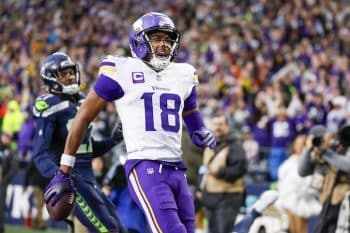Minnesota Vikings wide receiver Justin Jefferson runs into end zone.