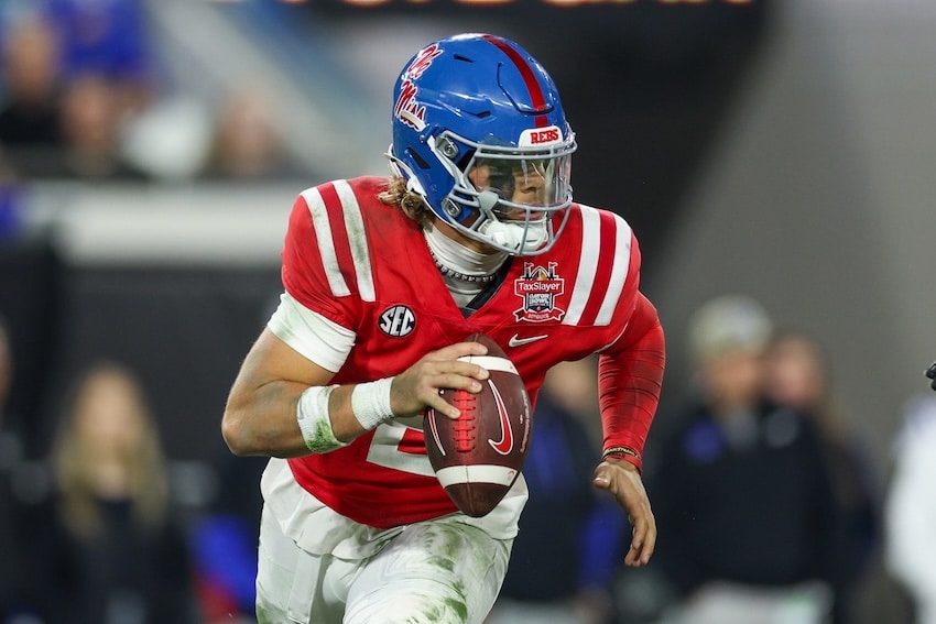 Mississippi Rebels quarterback Jaxson Dart runs with the ball.